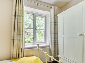 A bedroom with a window and a bed at Tyn Y Ffynnon in Betws-Y-Coed