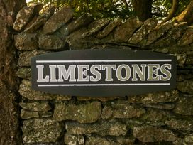 A sign reading 'LIMESTONES' on a stone wall at Limestone in Great Urswick