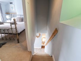 A staircase leading to a bedroom at 2 Cliff Cottages in West Portholland near Gorran Haven