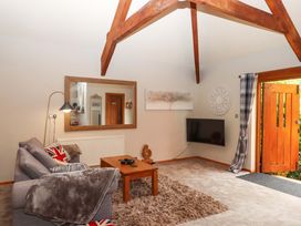 A living room with a sofa and coffee table at Little Torr in Drewsteignton