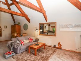A living room with a sofa and coffee table at Little Torr in Drewsteignton