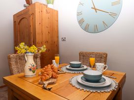 A dining room with a table set for breakfast at Little Torr in Drewsteignton