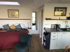 A bedroom with a bed and kitchen unit at The Sett on the Wharfe in Skipton