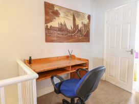 A work area with a desk and chair at 4 Trafalgar Square, Great Yarmouth