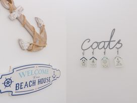 An entryway with anchor decor and coat hooks at 76A Mackworth Road, Porthcawl