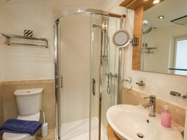 A bathroom with a shower, toilet, and sink at Elder Lodge, Kirkstone 5, Limefitt Park near Windermere