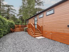 An outdoor area featuring a wooden deck and steps at Beech Grove Lodge Glade 17, Fallbarrow Park near Bowness on Windermere