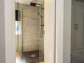 A shower area with a glass enclosure at Badgers Hollow Lodge in Grasmere 30, White Cross Bay near Windermere
