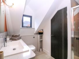 A bathroom with a sink and shower at Thornbury in Barnard's Green, Malvern