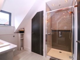 A bathroom with a sink and shower at Thornbury in Barnard's Green, Malvern