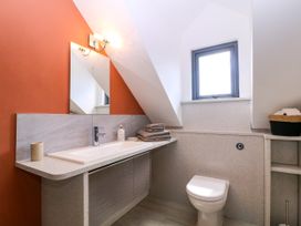 A bathroom with a sink and toilet at Thornbury, Barnard's Green, Malvern