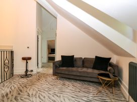 A living room with a sofa and a coffee table at Thornbury in Barnard's Green, Malvern