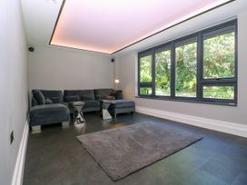 A living room with a sofa and a rug at Thornbury in Barnard's Green, Malvern