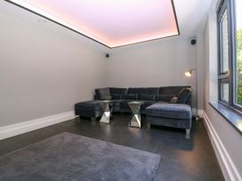A living room with a sofa and coffee table at Thornbury in Barnard's Green, Malvern