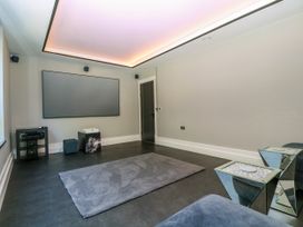 A living room with a television and sound system at Thornbury, Barnard's Green, Malvern