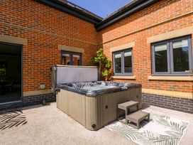 A hot tub with steps beside it at Thornbury, Barnard's Green, Malvern