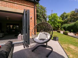 A garden with a hanging chair at Thornbury in Barnard's Green, Malvern