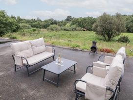 An outdoor seating area with a sofa, chairs, and a table at Ard na Gréine, Glenties, County Donegal