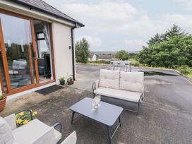 An outdoor seating area with a sofa and table at Ard na Gréine, Glenties, County Donegal
