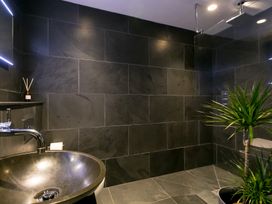 A bathroom with a sink and shower at Scilly Stack in Penzance