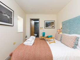 A bedroom with a bed and breakfast tray at Scilly Stack in St Just