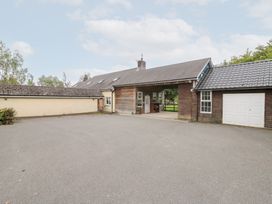 An outdoor area with a building and garage at Tynewydd Fields, Cross Inn