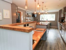 A kitchen with a sink and cooking hob at Tynewydd Fields in Cross Inn