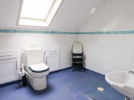 A bathroom with a toilet and sink at Tynewydd Fields in Cross Inn