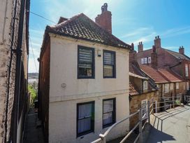 A view of a house with windows and a surrounding pathway at The Anchorage in Whitby