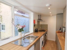 A kitchen with a sink, counter, and cooking appliances at The Anchorage in Whitby