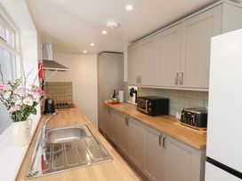 A kitchen with cabinets, sink, countertop and appliances at The Anchorage in Whitby