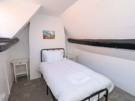 A bedroom with a bed and bedside table at The Anchorage in Whitby