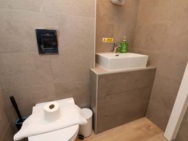 A bathroom with a toilet and sink at The Anchorage in Whitby