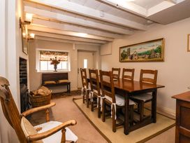 A dining room with a table and chairs at Dunning, The Mount York