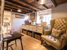 A snug with an armchair and a table in Dunning, The Mount, York