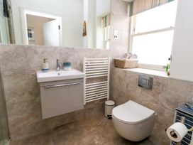 A bathroom with a sink and toilet at 4 The Beaches in Weymouth