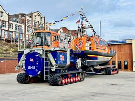 A lifeboat and tractor at Bridlington Lifeboat Station, Bridlington