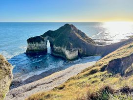 A coastal view featuring cliffs and an ocean at Bobbies' Retreat, 20 High Street, Bridlington