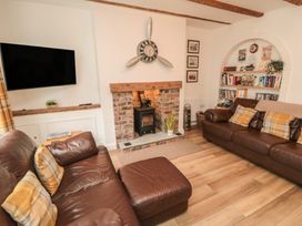 A living room with sofa and television at Bobbies' Retreat, 20 High Street in Bridlington