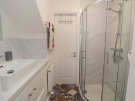 A bathroom with a shower and a sink at Bobbies' Retreat, 20 High Street, Bridlington