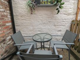 An outdoor space with a table and chairs at Bobbies' Retreat, 20 High Street Bridlington