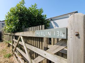 A gate with a sign reading Merlin 134 in the garden at Merlin in Malborough