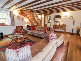 A living room with sofas and a coffee table at Greffyn in Betws-Y-Coed