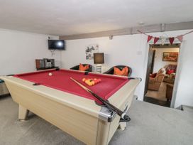 A snug room featuring a pool table and seating at Orsedd Wen Farmhouse Betws-Y-Coed