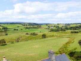 A landscape view with hills and trees at Orsedd Wen Farmhouse in Betws-Y-Coed