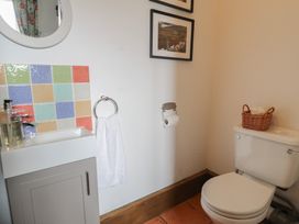 A bathroom with a sink and toilet at Orsedd Wen Cottage in Betws-Y-Coed