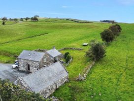 A house with fields and trees in the vicinity at Orsedd Wen Cottage Betws-Y-Coed