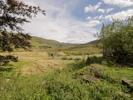 A view of mountains and grassland at Cwm in Capel Curig