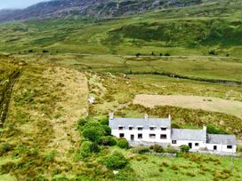 A house surrounded by fields and hills at Cwm in Capel Curig
