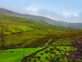 A landscape with mountains and a path at Cwm in Capel Curig